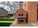 Brick oven, fire pit, and seating in a well-maintained backyard at 1053 S Washington St, Denver, CO 80209