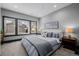 Bright bedroom with gray walls, plush carpet, and large windows allowing for plenty of natural light at 1053 S Washington St, Denver, CO 80209