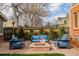 Cozy backyard fire pit with patio seating, perfect for outdoor gatherings and relaxation at 1053 S Washington St, Denver, CO 80209