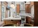 A bright kitchen features stainless steel appliances, and an island with a sink at 1053 S Washington St, Denver, CO 80209