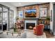 Warm living room with a brick fireplace, comfortable seating, and an inviting ambiance for gatherings at 1053 S Washington St, Denver, CO 80209