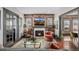 Inviting living room featuring a brick accent wall with fireplace, comfortable seating, and stylish decor at 1053 S Washington St, Denver, CO 80209