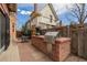 Outdoor kitchen featuring a built-in grill and plenty of counter space for entertaining at 1053 S Washington St, Denver, CO 80209