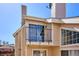 Condo balcony showcasing sliding glass doors, metal railings, and exterior architecture at 13782 E Lehigh Ave # B, Aurora, CO 80014