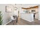 Cozy dining area adjacent to the kitchen with contemporary lighting and modern finishes at 13782 E Lehigh Ave # B, Aurora, CO 80014