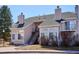 Multi-level condo building with stairs, well-maintained landscaping, and a clear sky at 13782 E Lehigh Ave # B, Aurora, CO 80014
