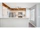 Kitchen with stainless steel appliances, granite counters, and cabinets with above storage at 13782 E Lehigh Ave # B, Aurora, CO 80014