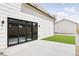 Backyard with concrete patio, artificial turf, a sliding glass door and wood fence at 3890 N Cook St, Denver, CO 80205