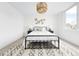 Inviting bedroom with comfortable bed, side tables and unique chandelier at 3890 N Cook St, Denver, CO 80205