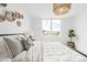 Comfortable bedroom with pillows and a cozy chandelier at 3890 N Cook St, Denver, CO 80205