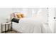 A bedroom with sliding glass door to the backyard, light walls, and stylish decor at 3890 N Cook St, Denver, CO 80205