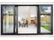 View through sliding glass doors to a dining room with a wood table, kitchen, and modern design at 3890 N Cook St, Denver, CO 80205