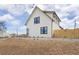 Striking two-story home with a modern design, white siding, and black framed windows at 3890 N Cook St, Denver, CO 80205