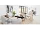 Open living space with stylish furniture, a modern art piece, and access to the backyard at 3890 N Cook St, Denver, CO 80205