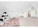 Open playroom features a teepee and plenty of space for activities and overlooks a bathroom at 3890 N Cook St, Denver, CO 80205