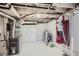 Basement featuring a mechanical area with white painted walls and a cart for storage at 4556 Decatur St, Denver, CO 80211