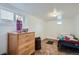 Finished basement bedroom with a dresser and window at 4556 Decatur St, Denver, CO 80211