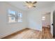 Bright bedroom featuring hardwood floors and natural light at 4556 Decatur St, Denver, CO 80211