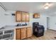 Kitchen featuring wood cabinets, ample counter space and a black gas range at 4556 Decatur St, Denver, CO 80211