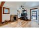 Inviting living room with hardwood floors, stone fireplace, and large-screen TV for entertaining at 4556 Decatur St, Denver, CO 80211