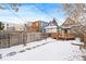 View of backyard, deck, and fence in winter at 1342 Lipan St, Denver, CO 80204