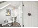 Modern bathroom with a pedestal sink, glass shower, and subway tile at 1342 Lipan St, Denver, CO 80204