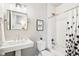 Clean bathroom with white subway tiles and pedestal sink at 1342 Lipan St, Denver, CO 80204