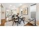 Stylish dining area features black table and chairs, great for entertaining at 1342 Lipan St, Denver, CO 80204