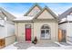 Charming craftsman home with red door and brick walkway at 1342 Lipan St, Denver, CO 80204