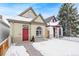 Charming house exterior with red door and snowy yard at 1342 Lipan St, Denver, CO 80204