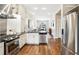 Modern kitchen with stainless steel appliances and white cabinets at 1342 Lipan St, Denver, CO 80204