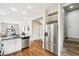 Modern kitchen with stainless steel appliances and white cabinets at 1342 Lipan St, Denver, CO 80204