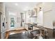 Modern kitchen with stainless steel appliances and white cabinets at 1342 Lipan St, Denver, CO 80204