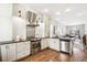 Modern kitchen with stainless steel appliances and white cabinets at 1342 Lipan St, Denver, CO 80204