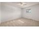 Bright bedroom featuring a ceiling fan and natural light from a window at 9042 E Lehigh Ave, Denver, CO 80237