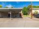 Carport for unit 5062 with blue skies above at 9042 E Lehigh Ave, Denver, CO 80237