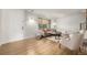 Cozy living room with light wood floors, neutral furniture, and natural light at 9042 E Lehigh Ave, Denver, CO 80237