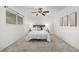 Bright main bedroom with natural light, neutral colors, and soft carpet at 9042 E Lehigh Ave, Denver, CO 80237