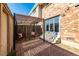 Outdoor patio area with a pergola and seating at 9042 E Lehigh Ave, Denver, CO 80237