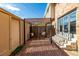 Outdoor patio area featuring a pergola and brick flooring at 9042 E Lehigh Ave, Denver, CO 80237