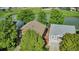 A quaint home is nestled near a picturesque pond and lush green trees, offering a serene living environment at 293 Wagonwheel Dr, Fort Lupton, CO 80621