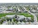 Aerial shot showcasing the home's location near a pond, golf course, and residential neighborhood at 293 Wagonwheel Dr, Fort Lupton, CO 80621