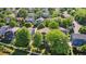 Aerial view of a neighborhood and lake in a beautiful park like setting at 293 Wagonwheel Dr, Fort Lupton, CO 80621