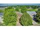Stunning aerial view of the property, showcasing lush greenery and a tranquil lake at 293 Wagonwheel Dr, Fort Lupton, CO 80621