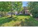 Expansive backyard with deck, patio, hot tub, and stunning lake views at 293 Wagonwheel Dr, Fort Lupton, CO 80621