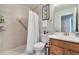 Clean and well-maintained bathroom features a shower, commode, and white vanity at 293 Wagonwheel Dr, Fort Lupton, CO 80621