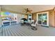The outdoor patio features a table, chairs, and a grill, perfect for entertaining or enjoying the views of the lake at 293 Wagonwheel Dr, Fort Lupton, CO 80621