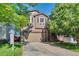 Charming two-story home featuring a two-car garage, front porch, and well-maintained landscaping for curb appeal at 293 Wagonwheel Dr, Fort Lupton, CO 80621