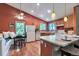 Bright kitchen with wood cabinets, light countertops, a breakfast nook, and modern appliances at 293 Wagonwheel Dr, Fort Lupton, CO 80621
