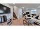 Cozy living space featuring modern decor, a television, and staircase to another level at 293 Wagonwheel Dr, Fort Lupton, CO 80621